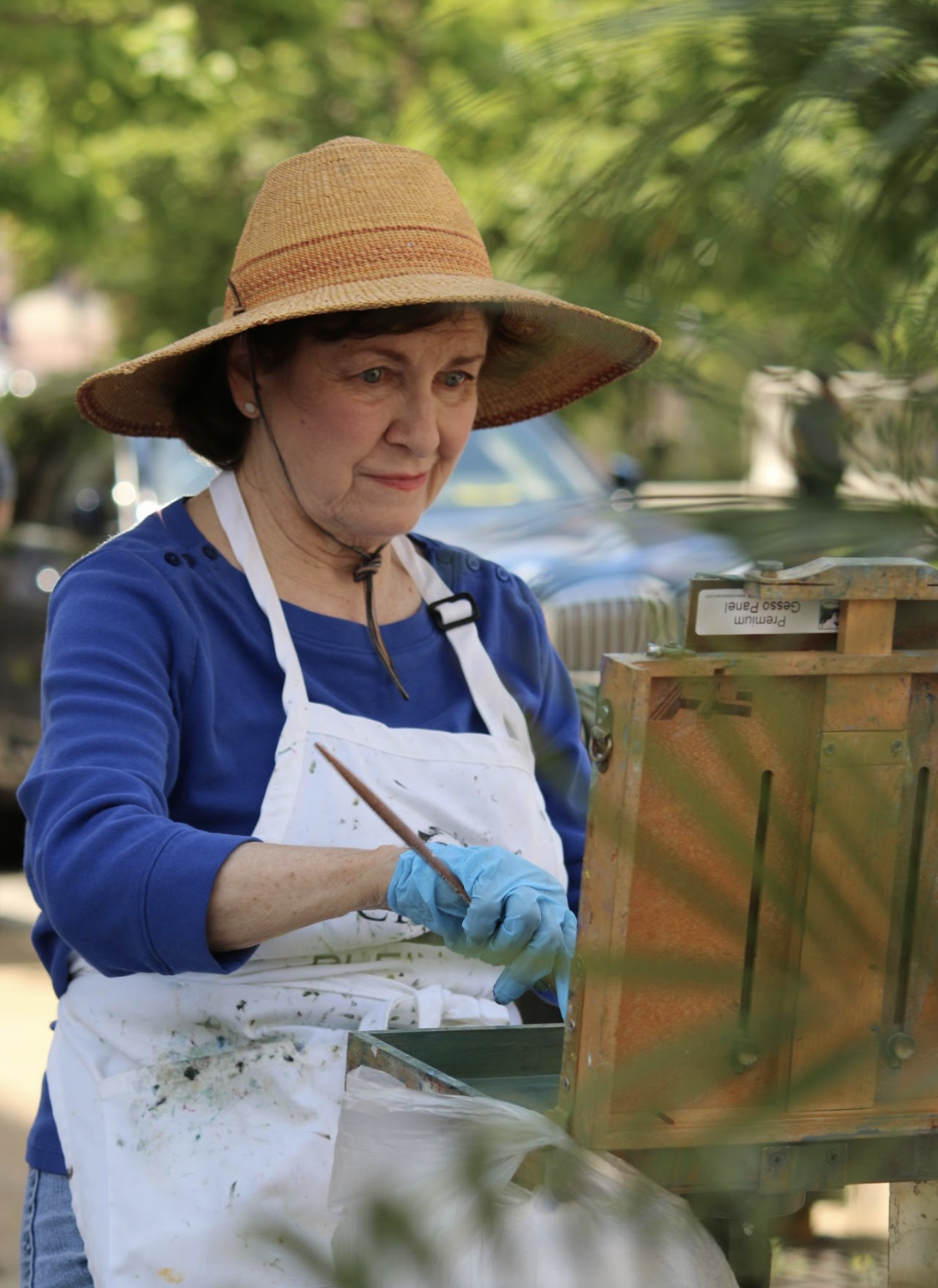 woman painting at easel