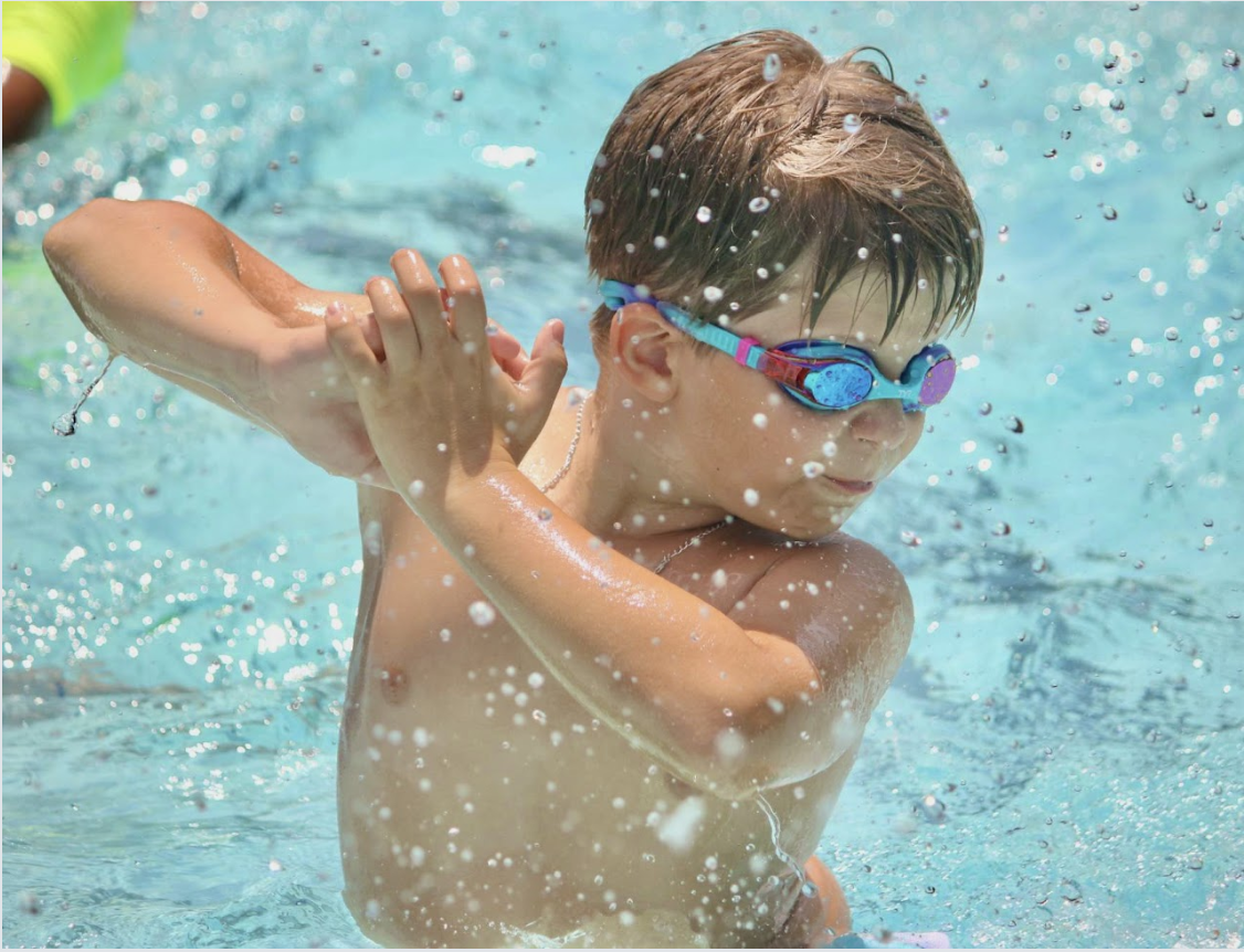 boy splashing in water